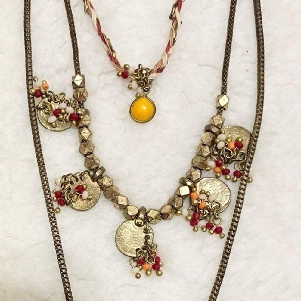 Three layer gold tone necklace with red yellow gold white beads